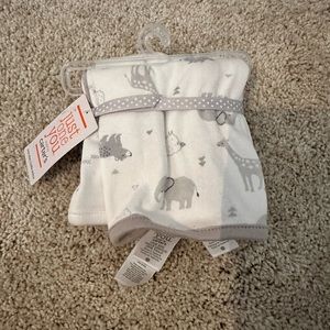 Set of Carters burp cloths. New with tags.